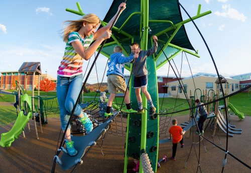 kids playing on commercial playgrounds